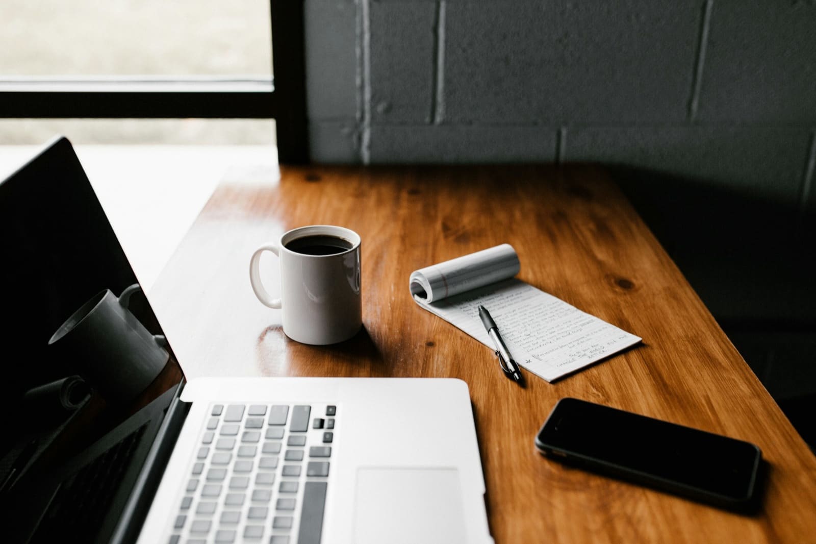 Planning a Costa del Sol property search from the UK — notes beside a laptop
