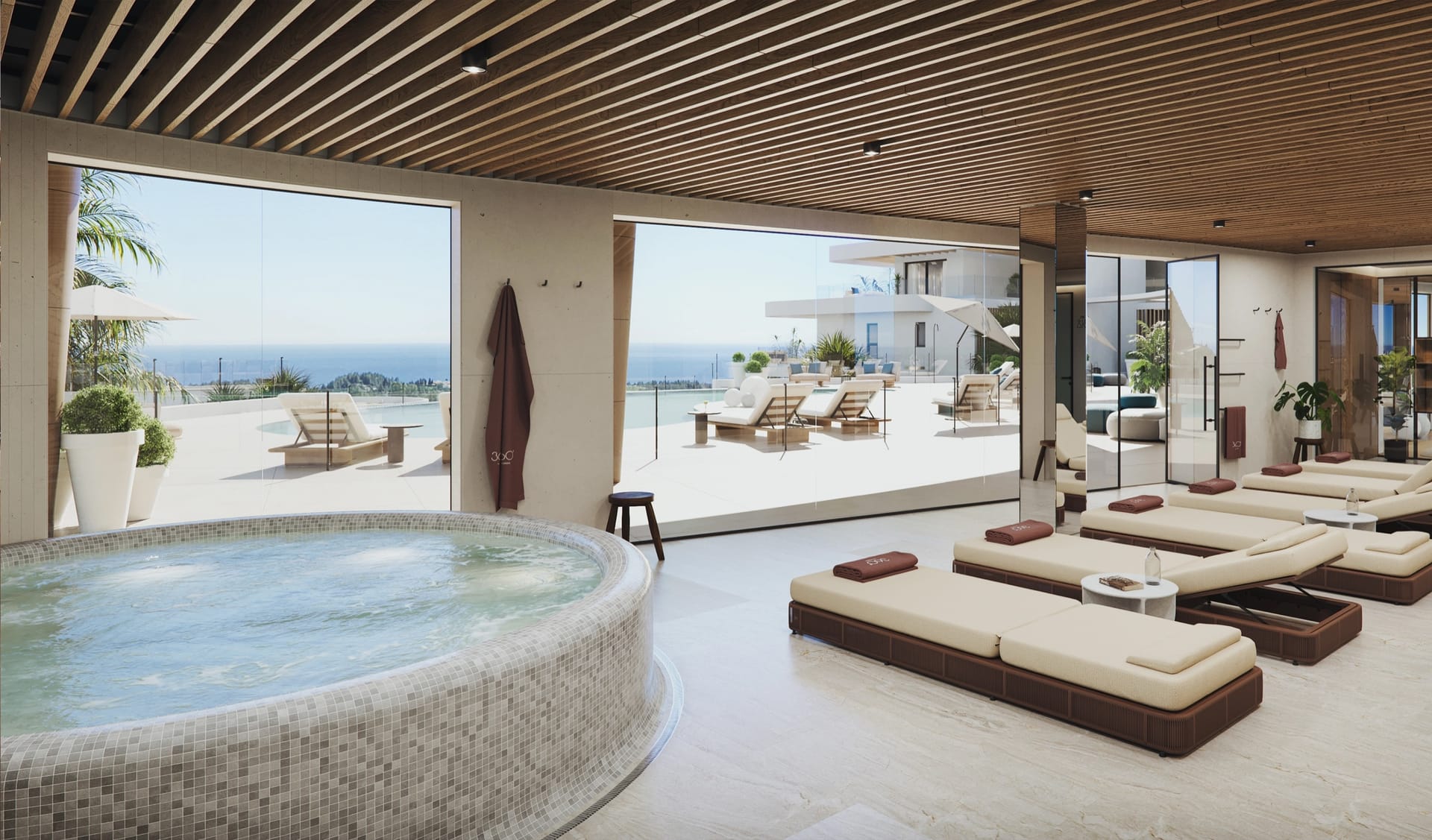 The spa, with its jacuzzi and loungers beside the windows. 360º, Cerrado del Águila, Mijas.
