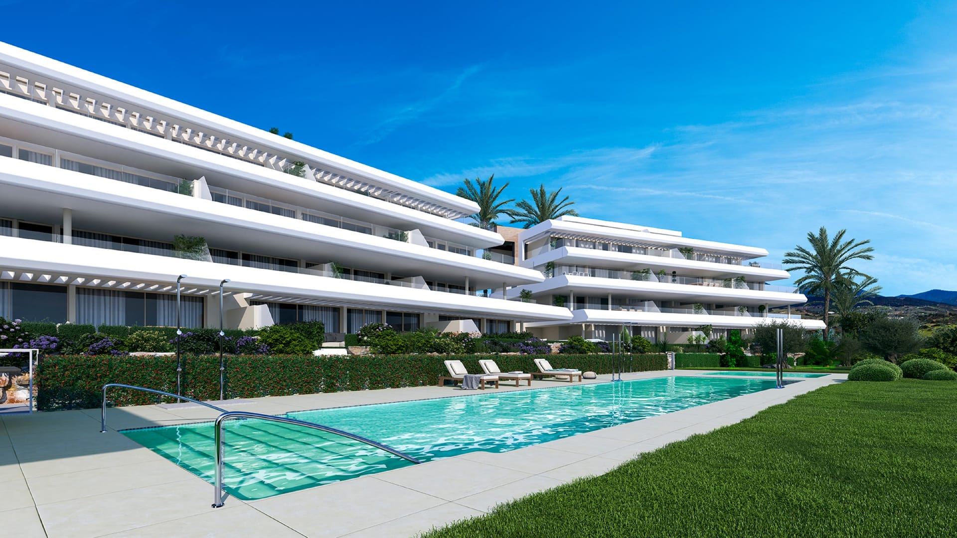 The pool, laid out along the gardens in front of the buildings. Absolute Estepona, Buenas Noches, Estepona.