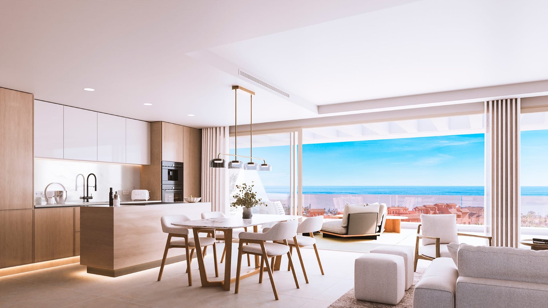 The kitchen and living room, opening onto a terrace with a view of the sea. Absolute Estepona, Buenas Noches, Estepona.