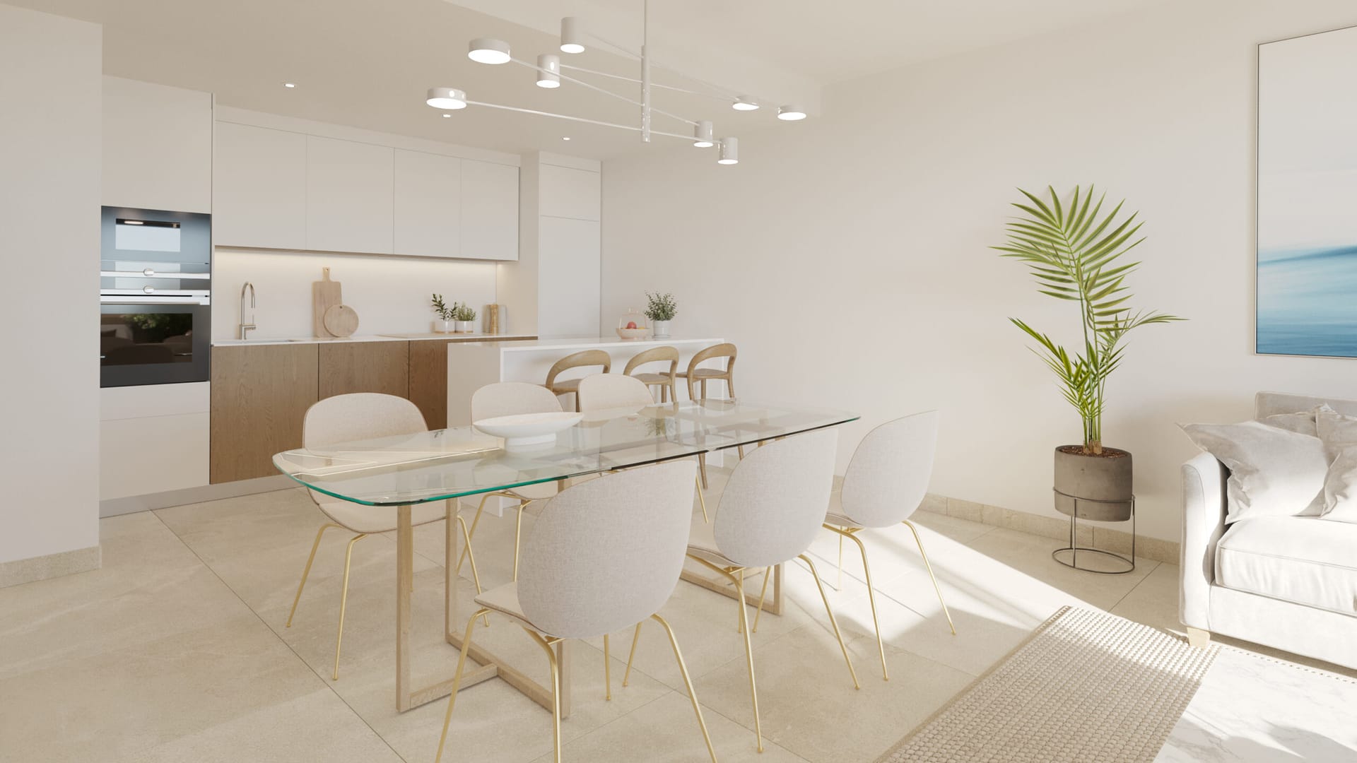 The kitchen and dining area, with white units and a glass table. Adagio, Cancelada, Estepona.