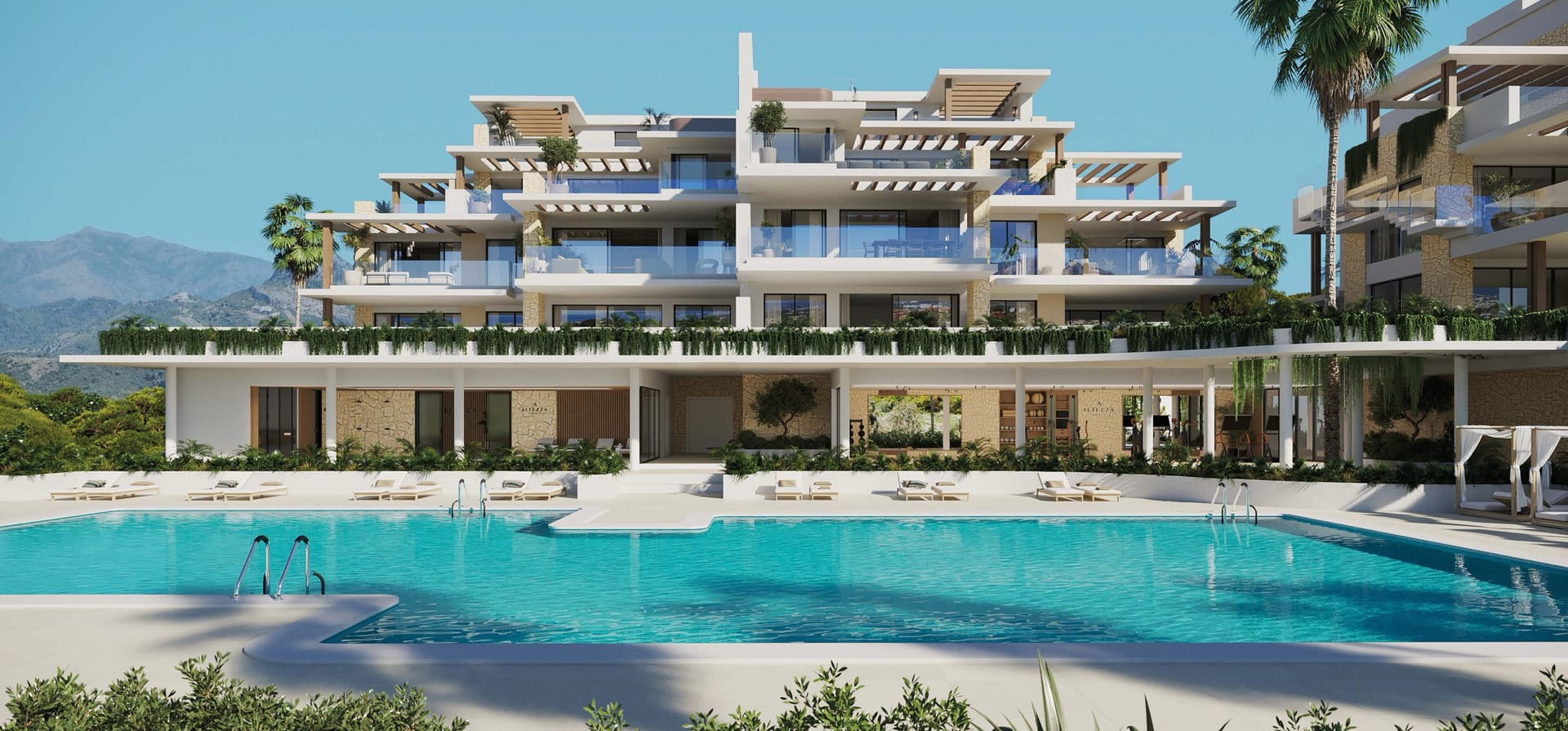 One of the two outdoor pools, with the buildings behind it. Altezza Suites, La Resina, Estepona.