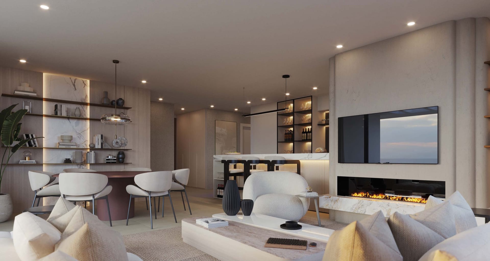 A living room with a fireplace, opening onto the dining area. Altezza Suites, La Resina, Estepona.