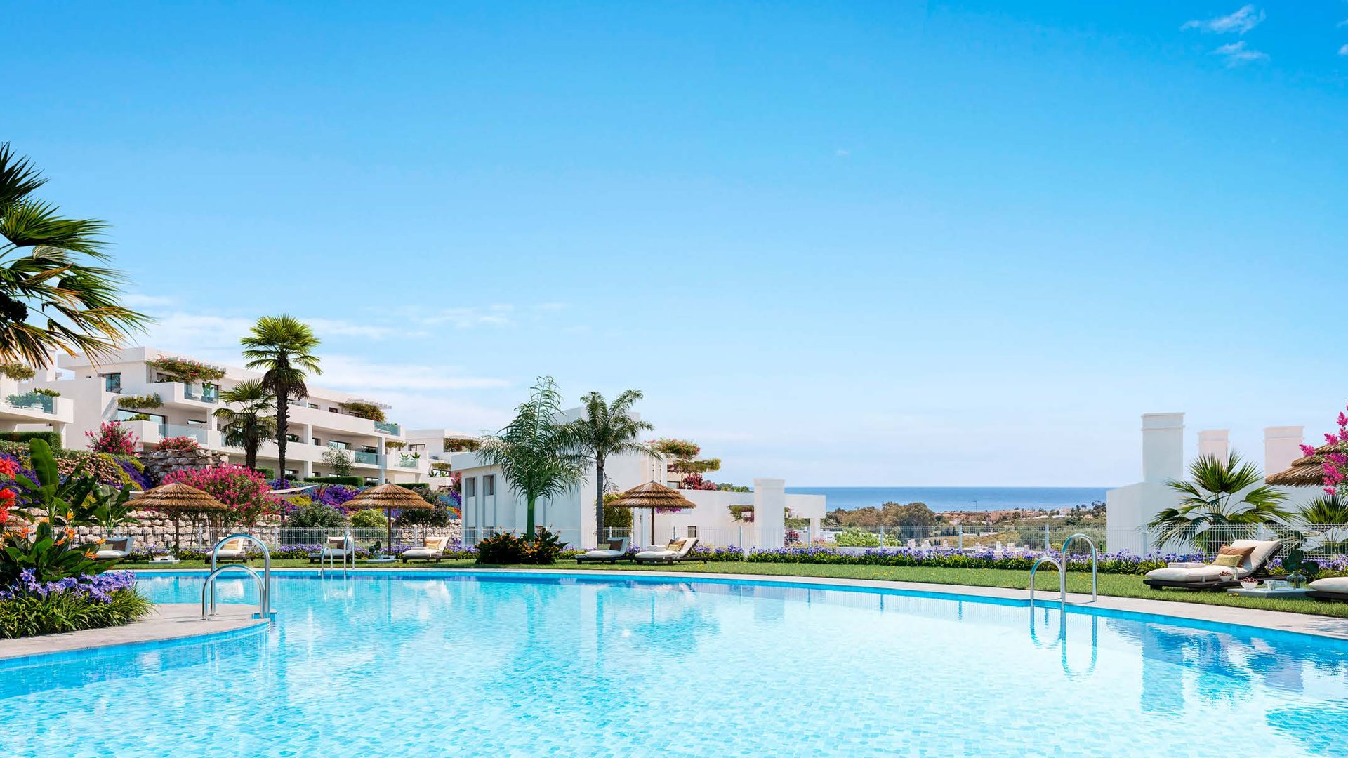 The communal pool by day, palms along its edge, the buildings behind it and the sea past the fairways. Amaranta Living, Casares Costa Golf, Casares.