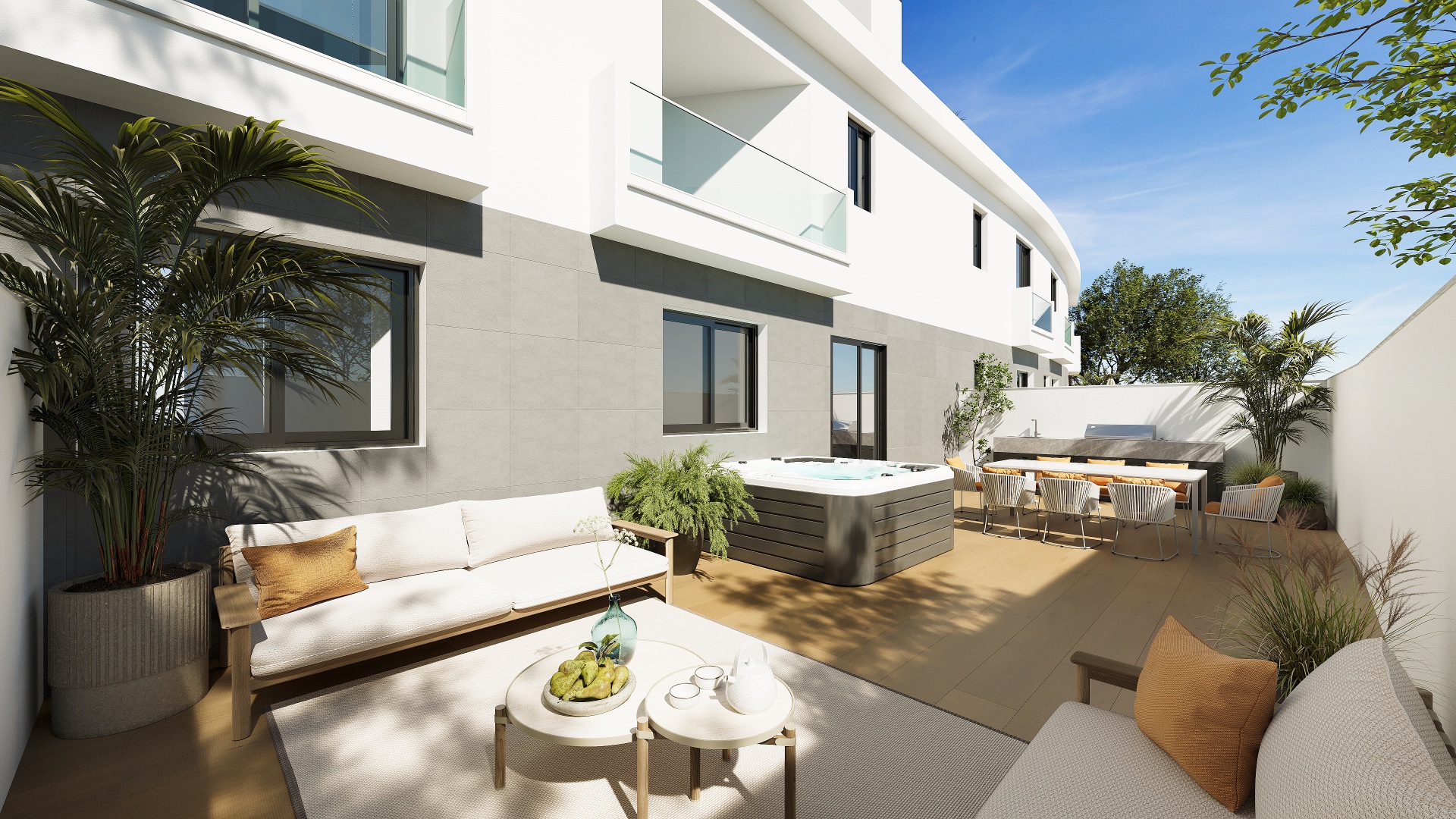 A ground-floor terrace, walled on three sides, with the building behind it. Azure Homes, Los Pacos, Fuengirola.