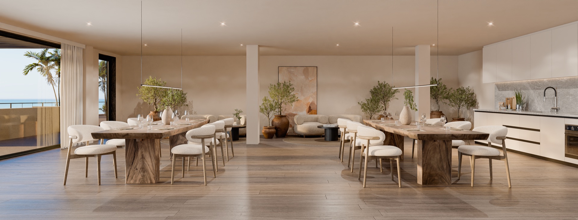 The residents’ social club, with two long shared tables, its own kitchen, and the sea beyond the terrace doors. Balance, Hipódromo, Mijas.