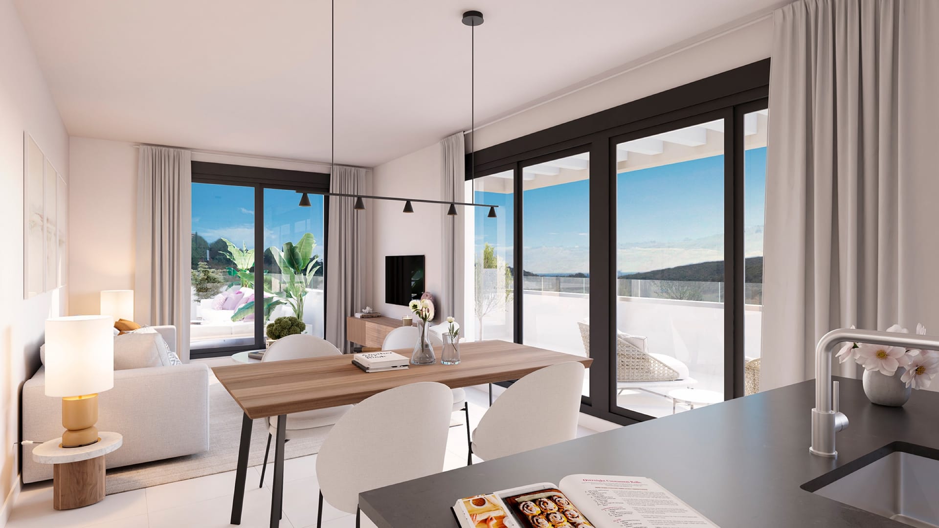 The living room and kitchen, opening onto a terrace. Bliss Homes, Casares Costa, Casares.