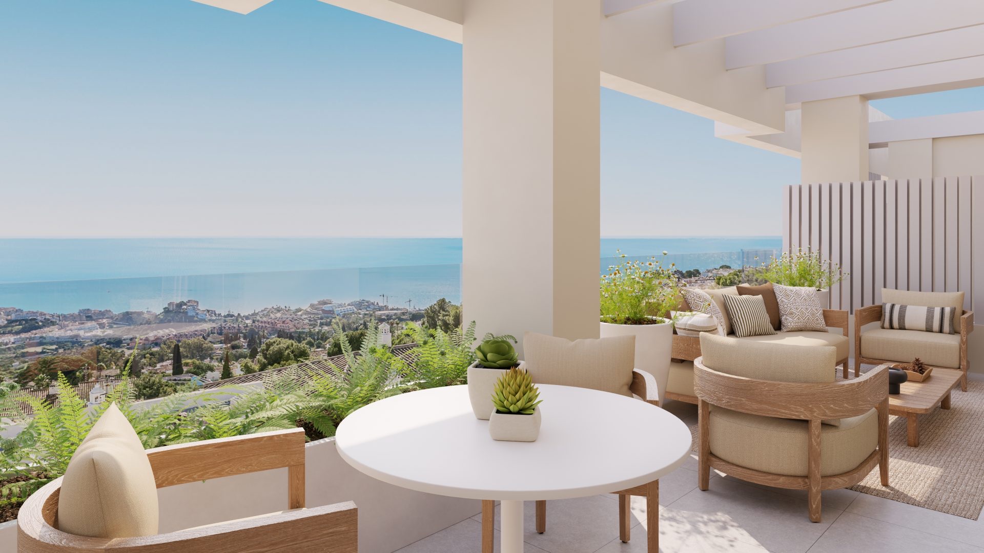 The view from a terrace over Benalmádena towards the coast, the sea visible past the rooftops below. Blossom Hills, Benalmádena Pueblo, Benalmádena.