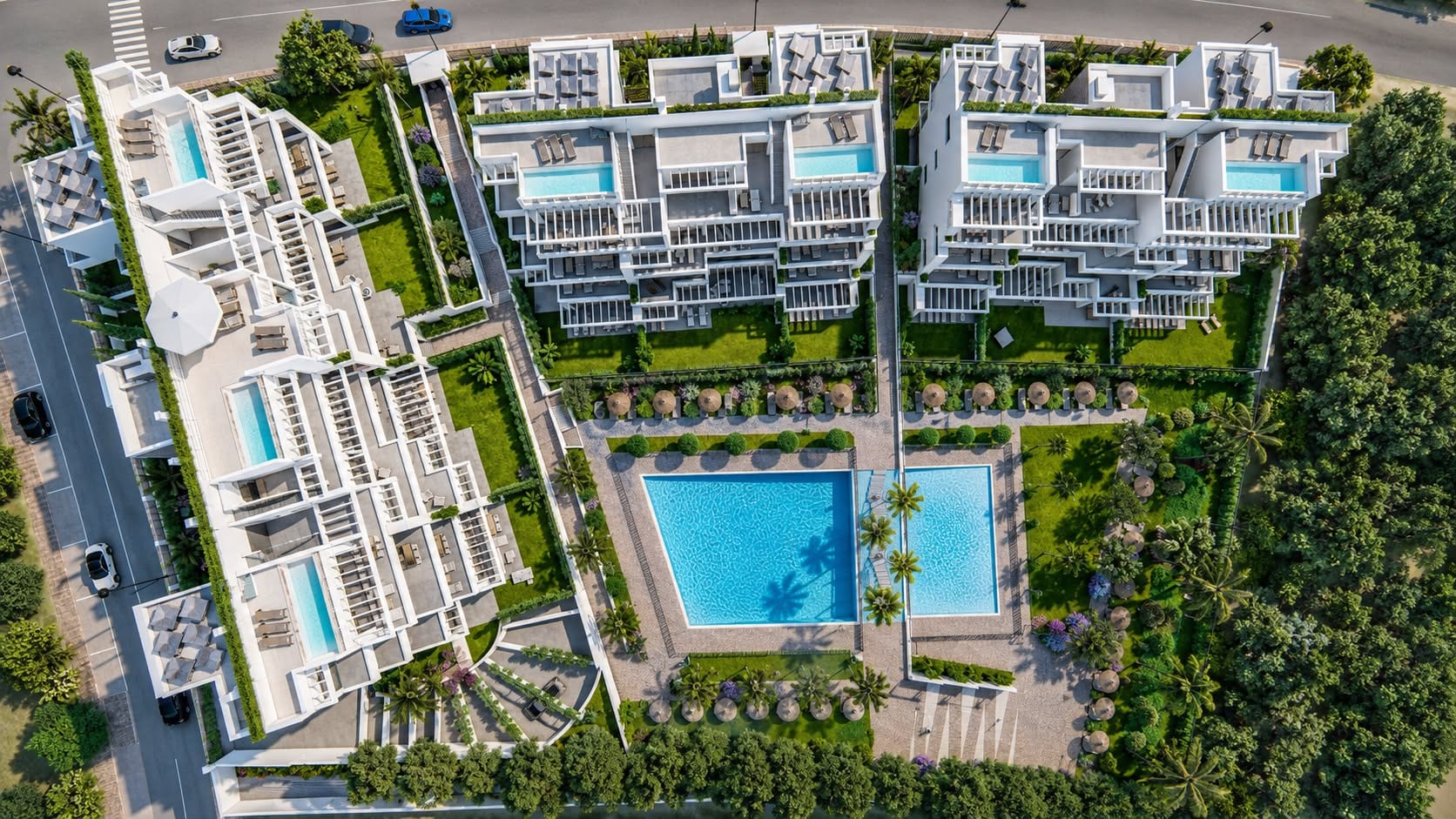 An aerial view of the buildings, with the two communal pools and gardens between them and the private pools on the penthouse roofs. Costafiore Gardens, Arroyo Enmedio, Estepona.