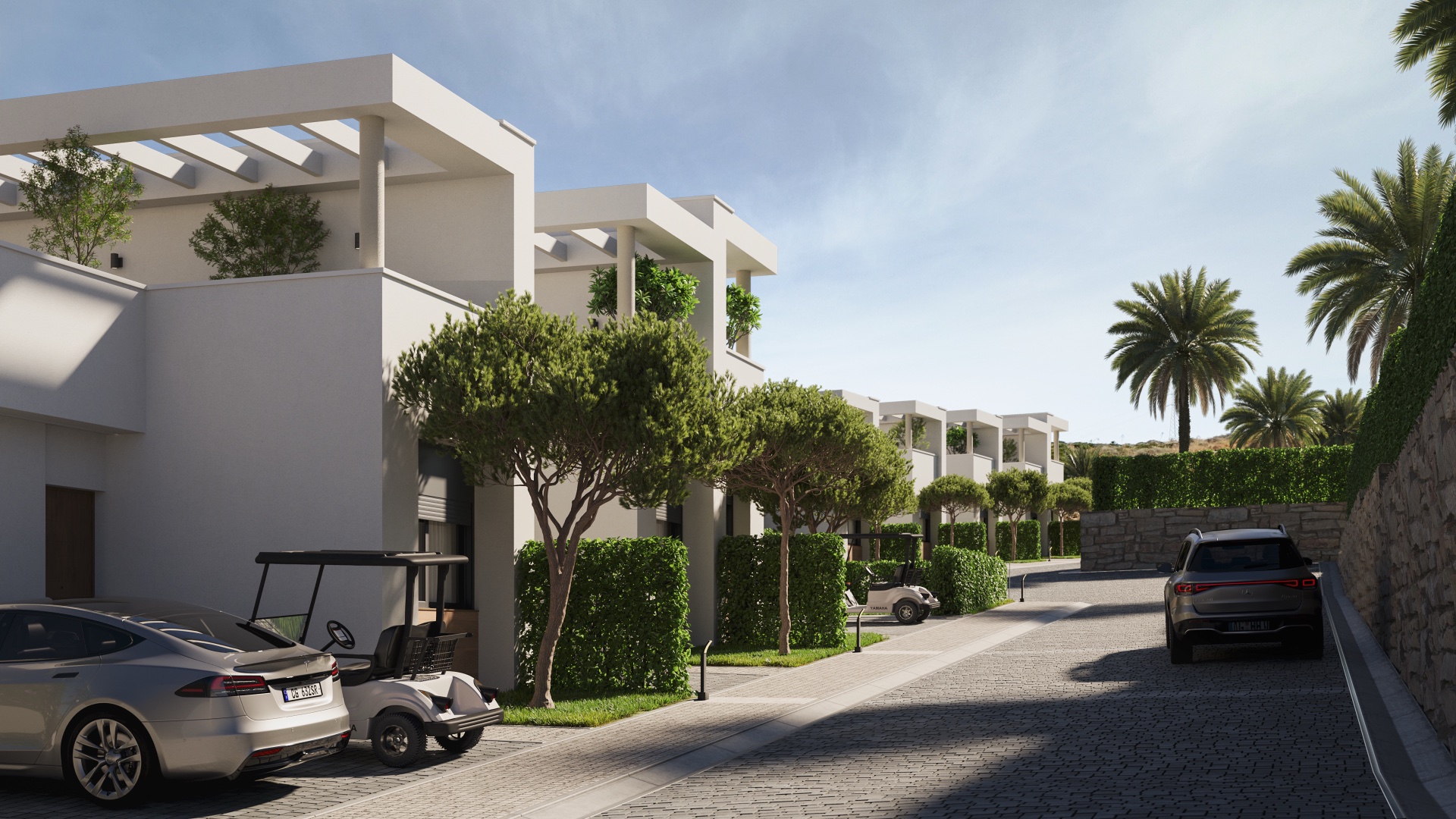 The private street running between the houses, with parking in front of each one. Green Valley, Cerrado del Águila, Mijas.