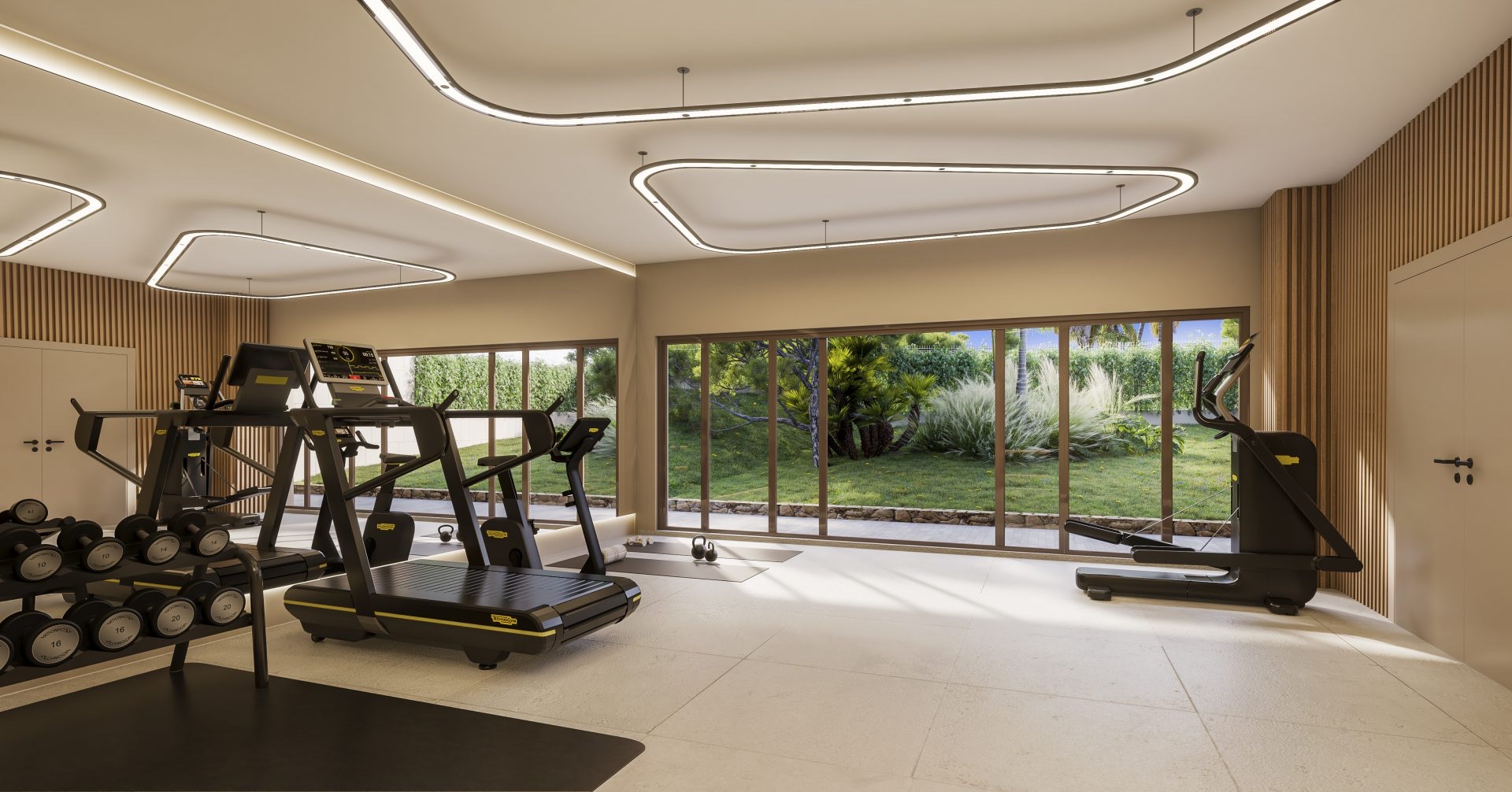 The gym, with a garden view through full-height windows. Helvet Green, Mijas Golf, Mijas.