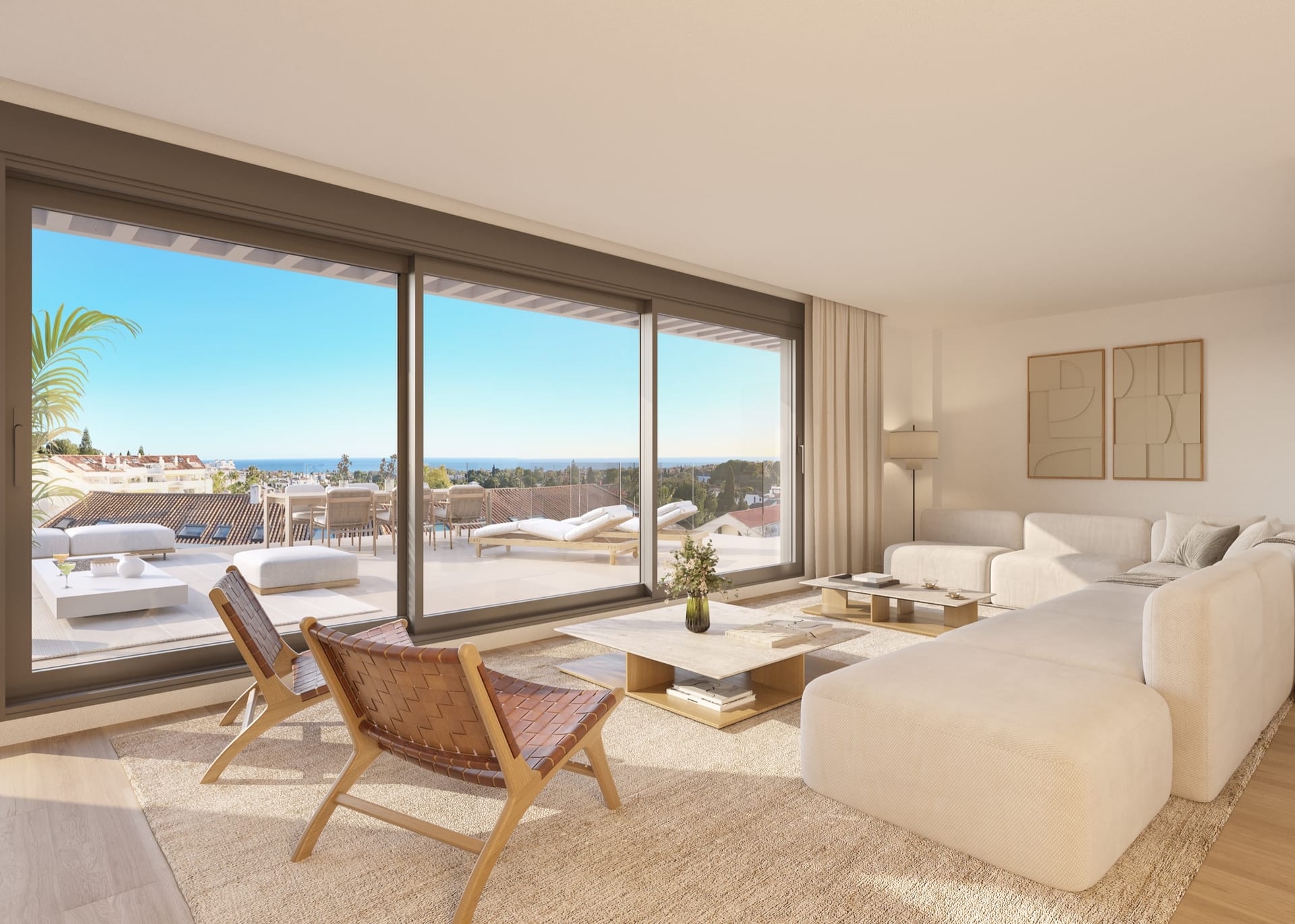 A living room with a sliding glass wall onto a terrace over the coast. Isla Bela, Nueva Andalucía, Marbella.