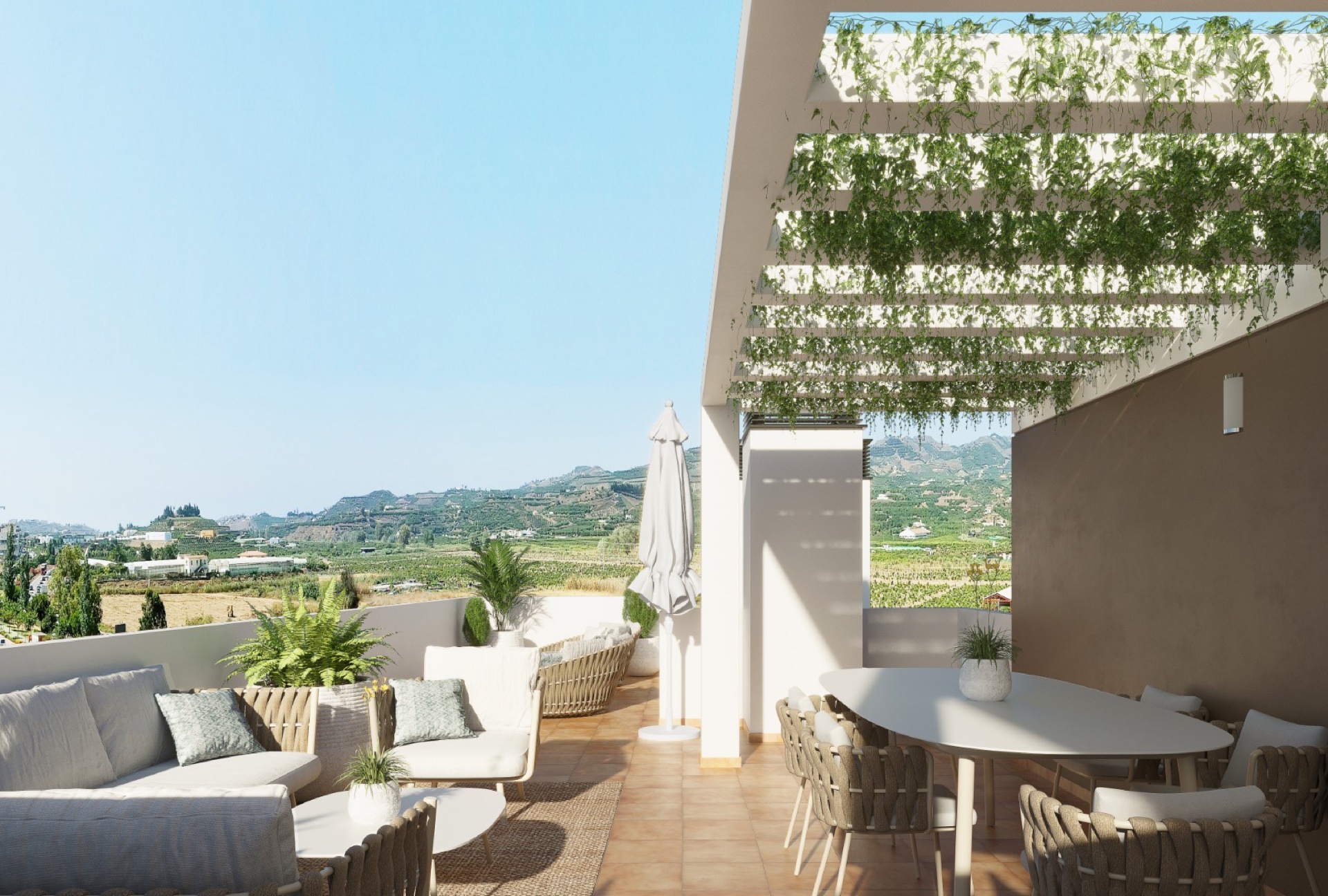 A penthouse roof terrace under a planted pergola, looking out to the hills behind the town. Los Olivos Residencial, El Ensanche, Vélez-Málaga.