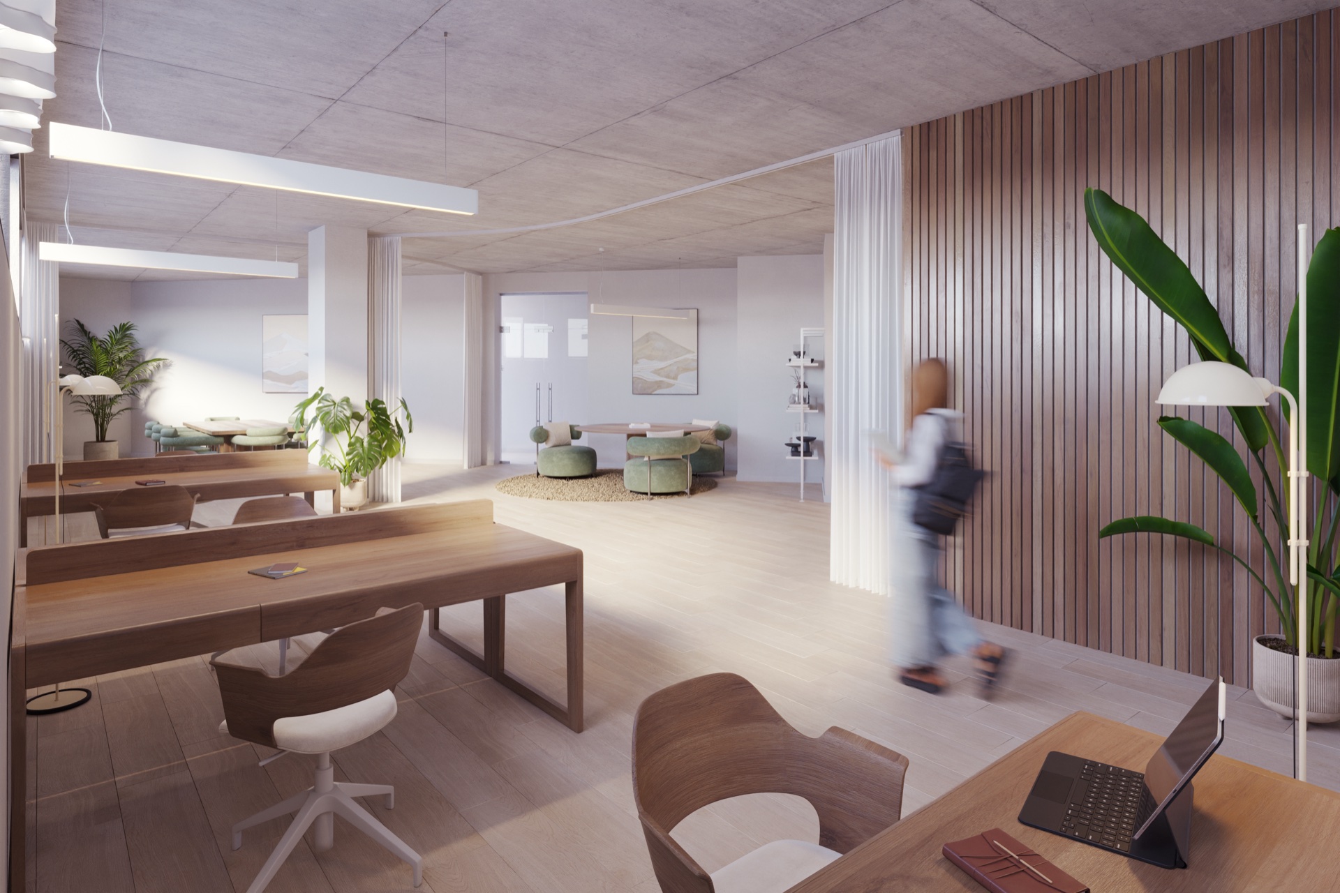 The coworking room, with shared desks, task chairs and a seating area at the far end. Luminal Homes, Los Pacos, Fuengirola.