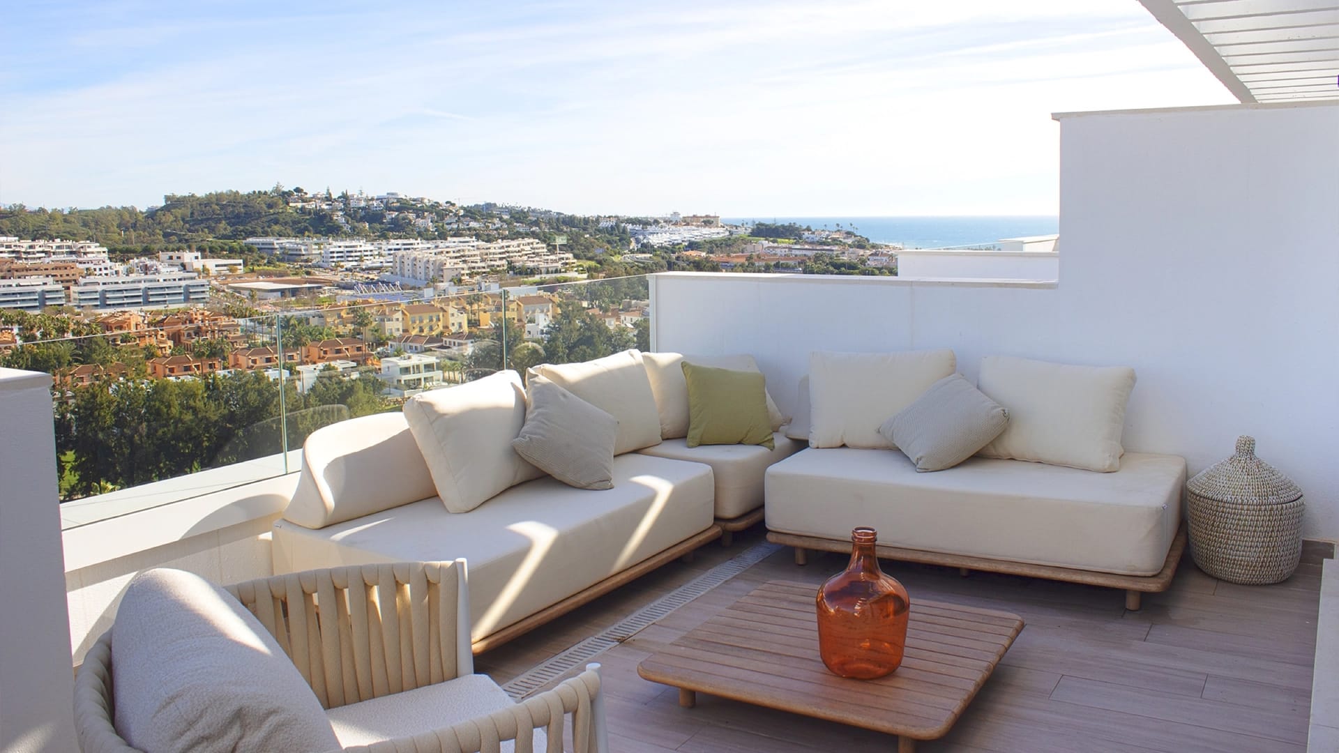 A roof terrace with seating, looking over the coast. Navigolf Suites, La Cala de Mijas, Mijas.