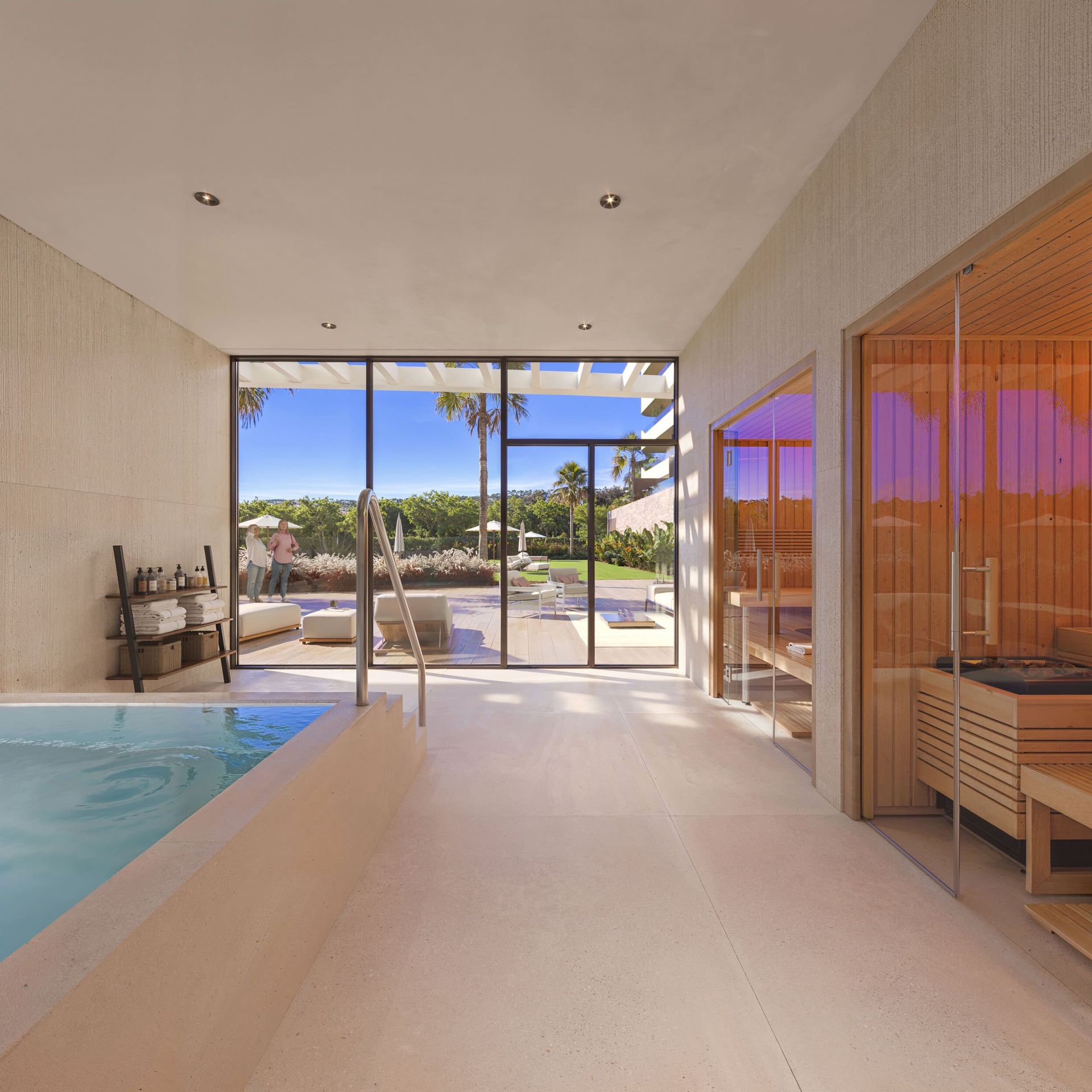 The spa, with an indoor pool, a sauna behind glass, and doors onto the garden. Ocean Garden, Los Pacos, Fuengirola.