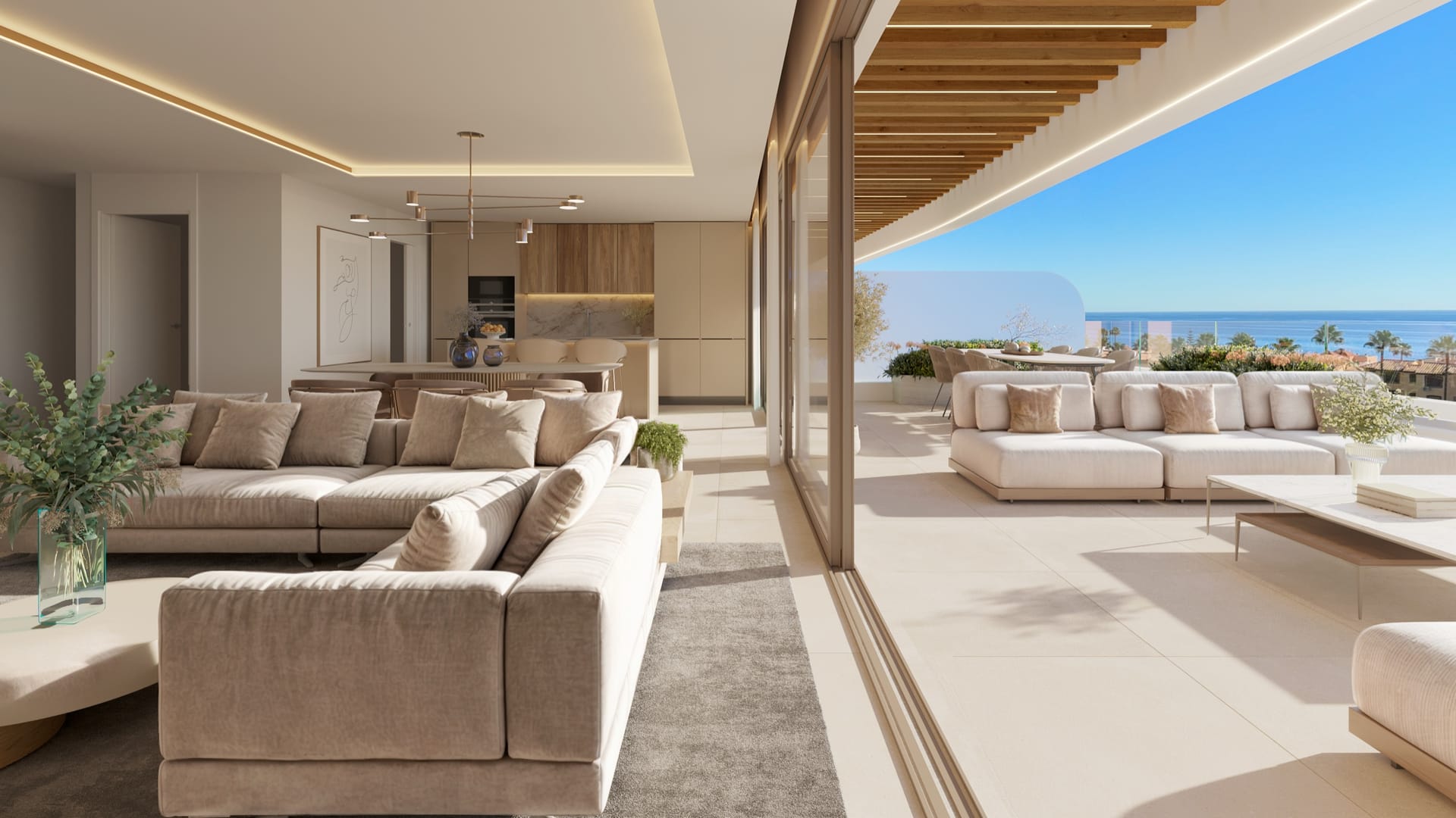 A living room and kitchen opening onto the terrace. Privilege Suites, Casares Costa, Casares.