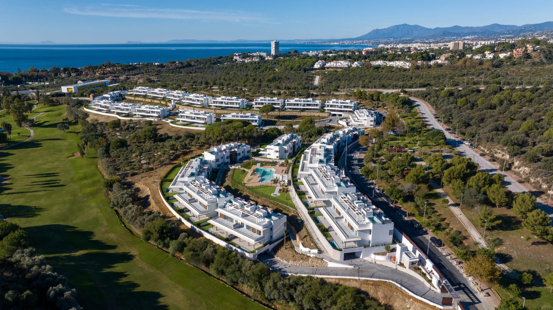 An aerial view of the new development and the golf course, with Marbella and the sea beyond. Santa Clara Homes, Los Monteros, Marbella.