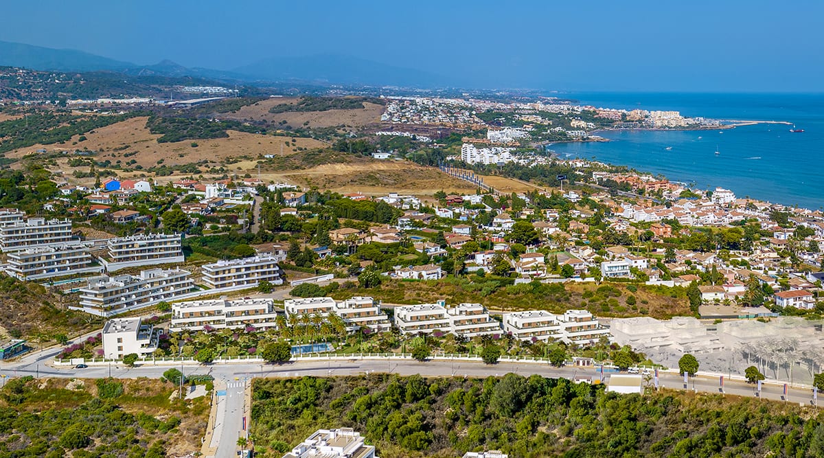 An aerial view of the buildings and their gardens, with Estepona and the sea in the distance. Sunset Bay Estepona, La Gaspara, Estepona.