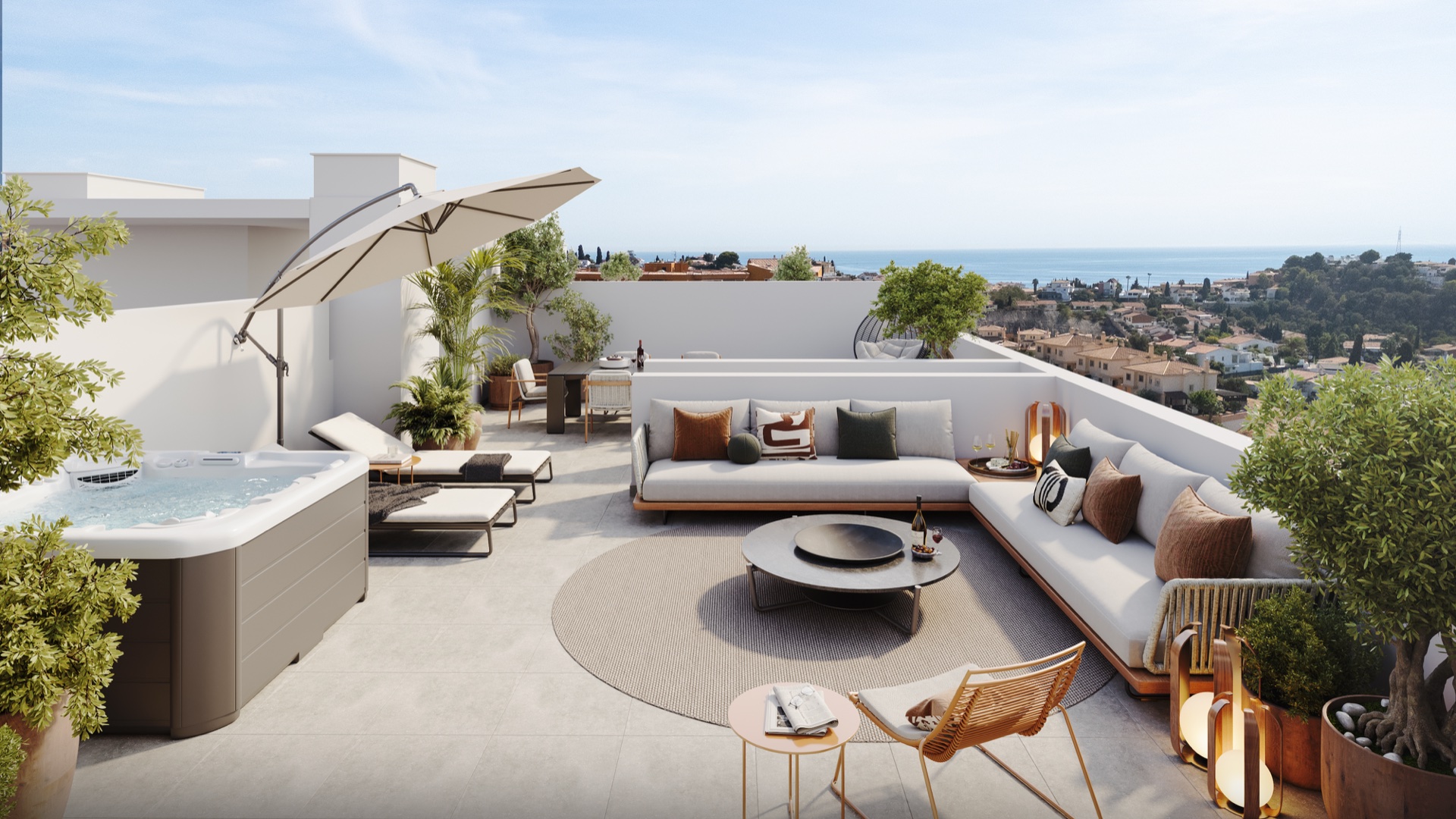 A roof terrace, with an outdoor spa bath, a corner sofa and a parasol above the town. Sunset Views, Los Pacos, Fuengirola.