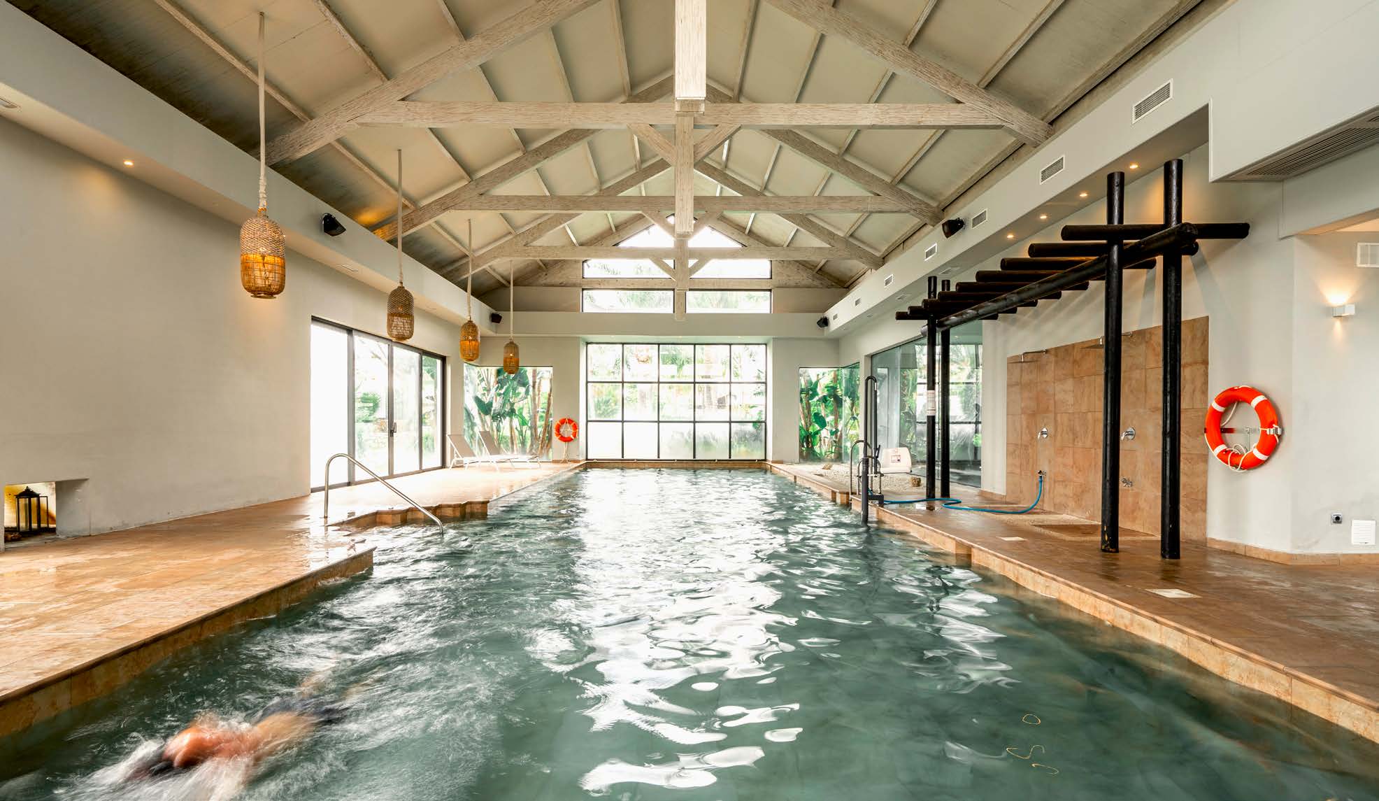 The club’s heated indoor pool, under a timber roof. The Club Villas, El Campanario, Estepona.