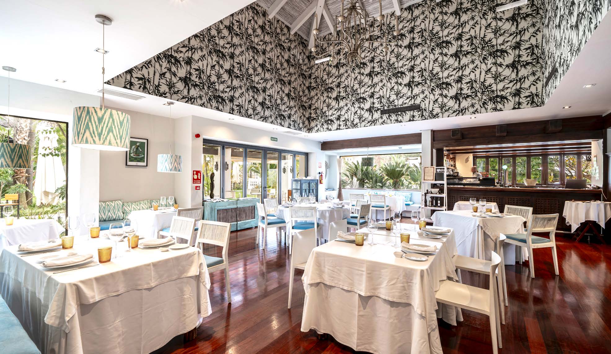 The club restaurant, with tables laid under a patterned ceiling. The Club Villas, El Campanario, Estepona.
