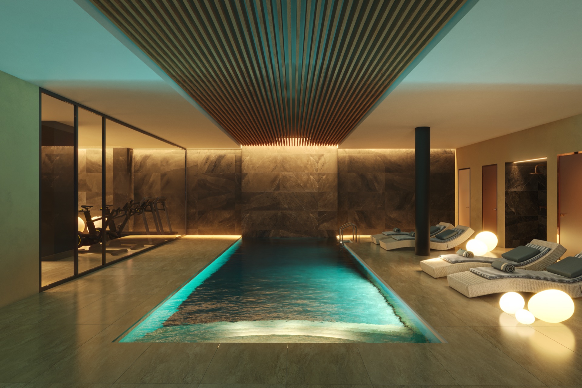 The heated indoor pool, under a slatted timber ceiling, with loungers along one side. Torre Biznaga, Carvajal, Fuengirola.