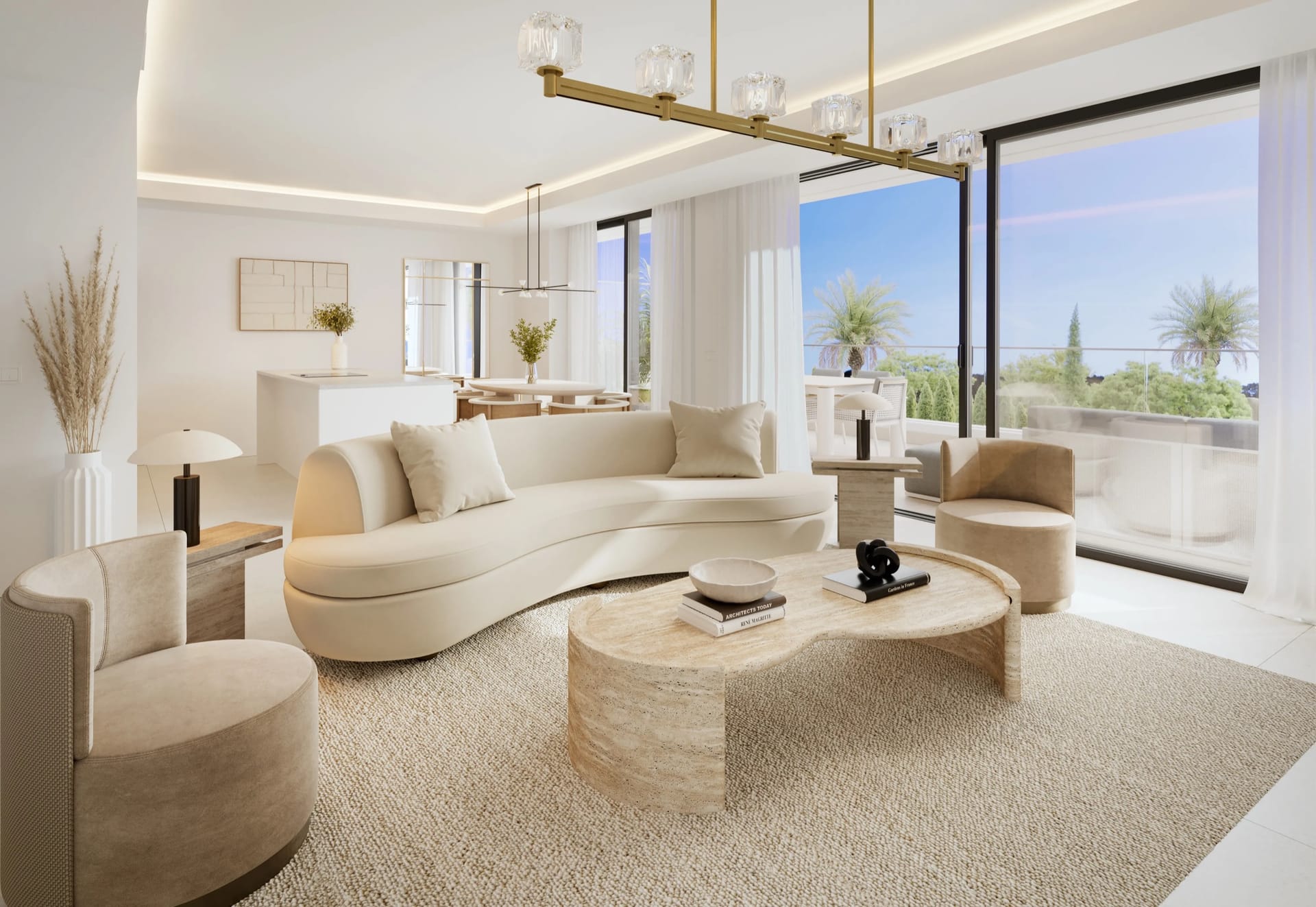 A living room with a curved sofa, open to the dining area, with tall glass doors to the terrace. Unika Collection, Buenas Noches, Estepona.