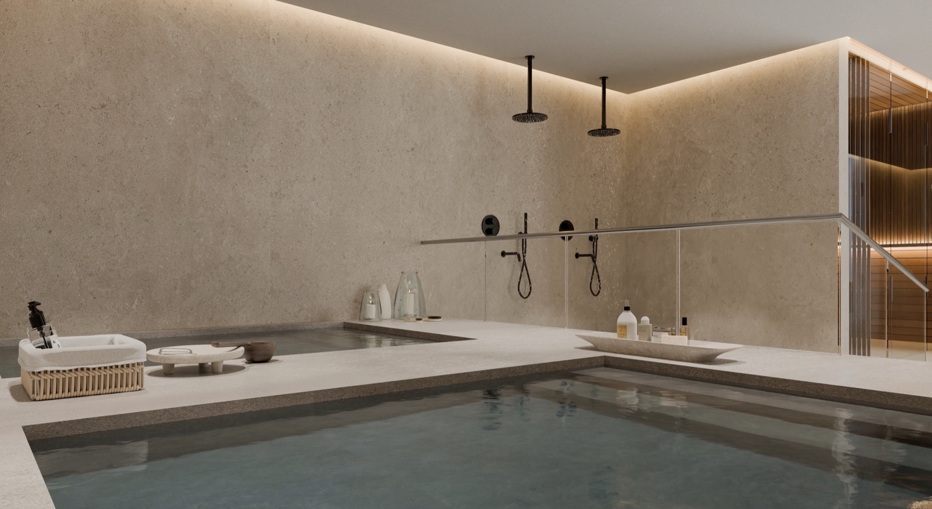 The spa, with two plunge pools, ceiling showers against a stone wall, and the sauna behind glass on the right. Unique Infinity, El Higuerón, Fuengirola.