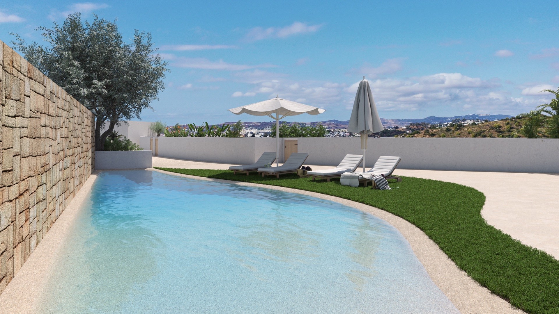 One of the two outdoor pools, whose shallow edge slopes into the water from the lawn, with loungers and parasols set out on the grass. Urban City Horizon, Torreblanca, Fuengirola.