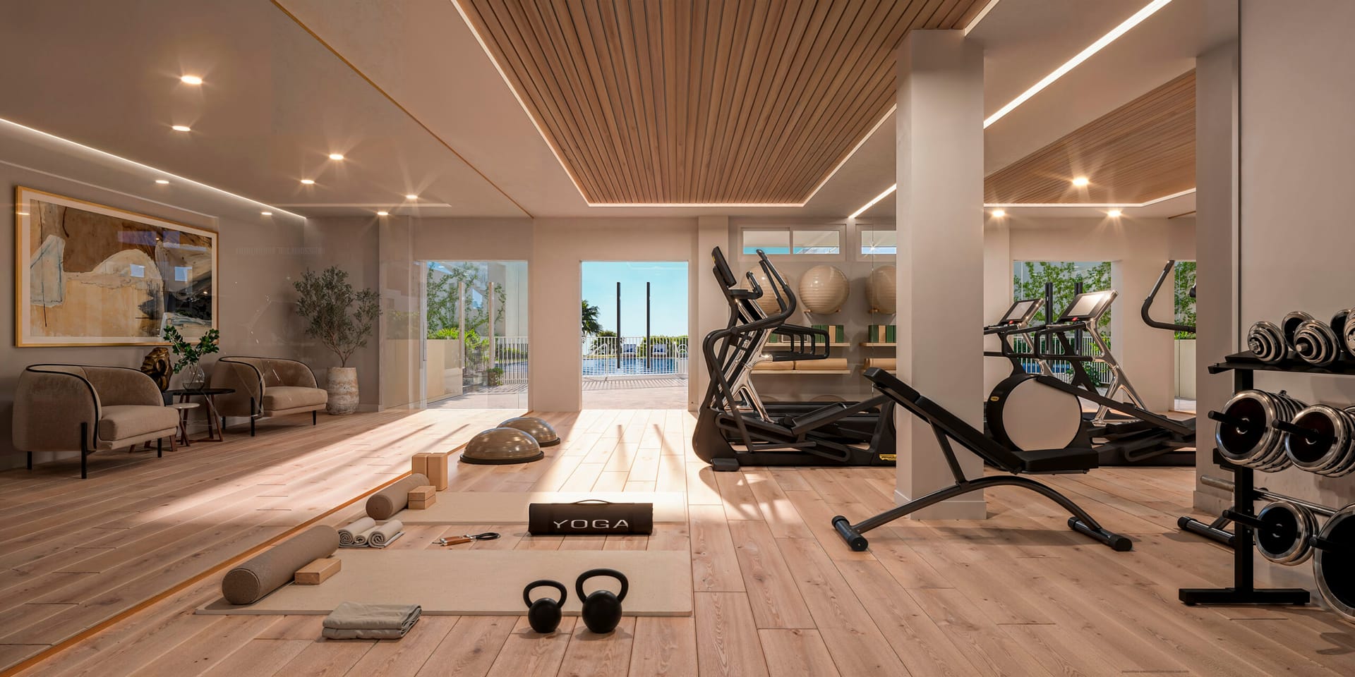 The residents’ gym, with exercise machines, free weights and mats for yoga, and doors that open towards the pool. Zenith Estepona, El Calvario, Estepona.