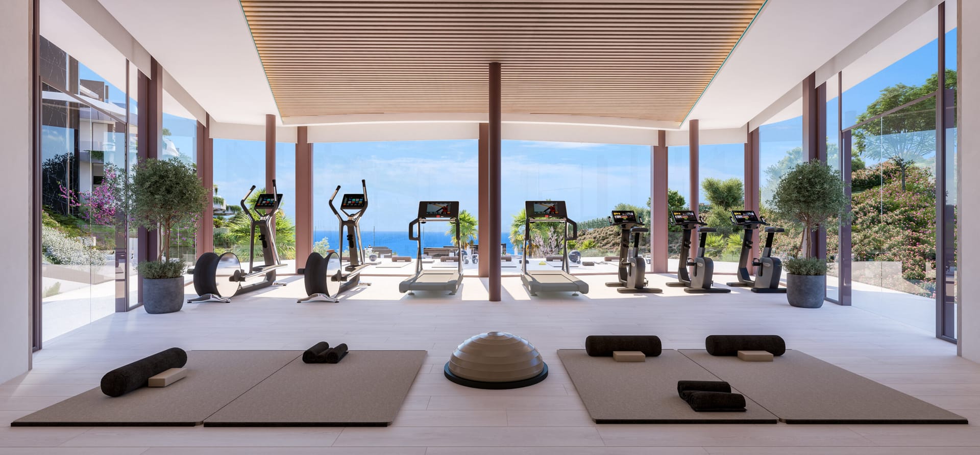 The gym, with glass walls looking out over the gardens. ZEW Elviria, Elviria, Marbella.